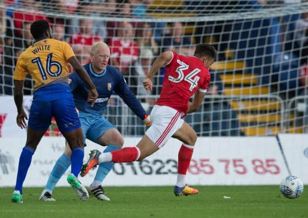 Mansfield Town vs Nottingham Forest - Conrad Logan and Hayden White get into a mix up allowingTyler Walker to score - Pic By James Williamson