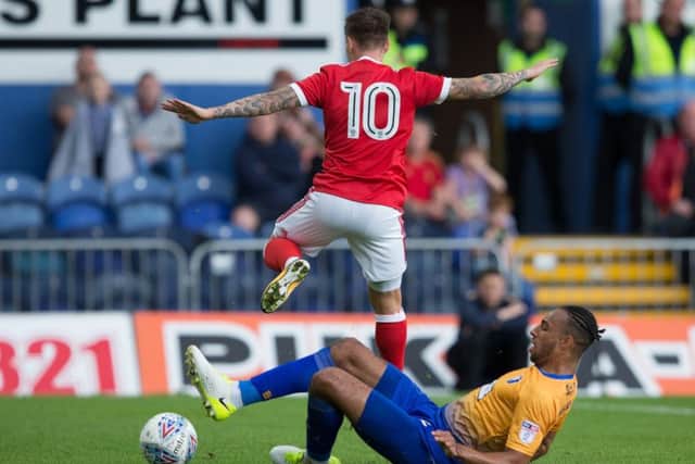Mansfield Town vs Nottingham Forest - Rhys Bennett tackles Barrie McKay - Pic By James Williamson
