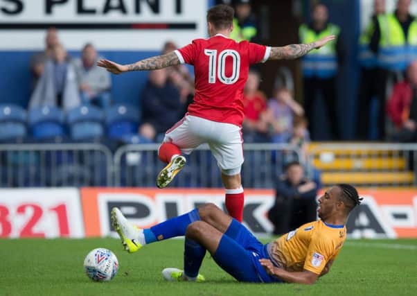 Mansfield Town vs Nottingham Forest - Rhys Bennett tackles Barrie McKay - Pic By James Williamson