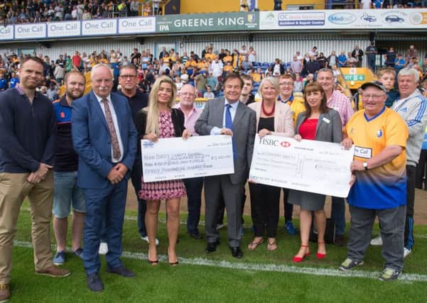 Mansfield Town vs Nottingham Forest - A Cheque for 15,100 pound is presented to the Alzheimers Society and the Once upon a Smile foundation from the proceeds raised at Kevin Bird's charity match  - Pic By James Williamson