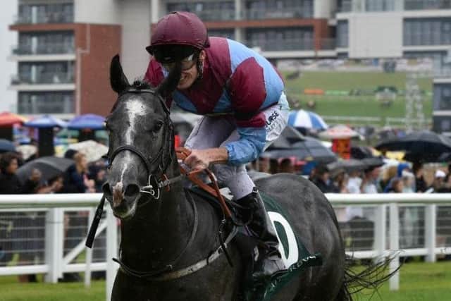 Bengali Boys, ridden by Barry McHugh and trained by Richard Fahey, storms to an easy victory in the big race of the weekend at rain-soaked Newbury, the Weatherbys Super Sprint for 2yos.