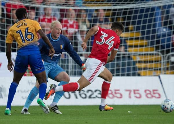 Mansfield Town vs Nottingham Forest - Conrad Logan and Hayden White get into a mix up allowingTyler Walker to score - Pic By James Williamson