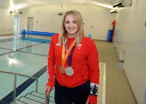 Charlotte Henshaw pictured with her Paralympic silver and bronze medals from London 2012 and Rio 2016 before making the switch from swimming to canoeing