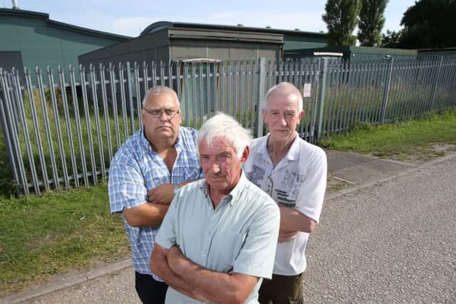 Elizabethan Railway Society members Mick Key, Andrew Bonser and Gordon Rush  in front of the building.