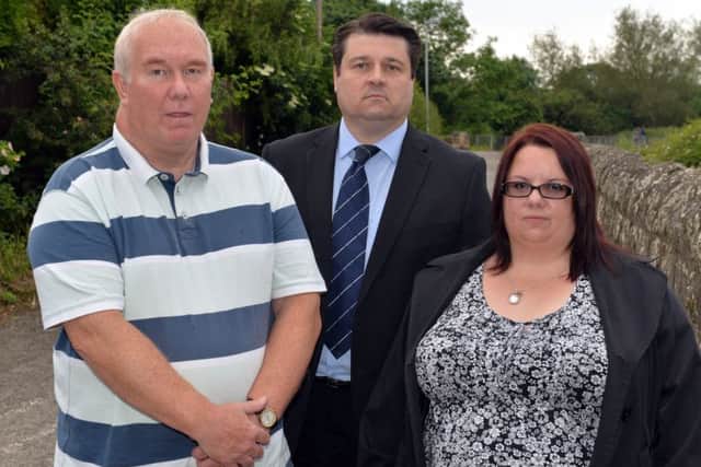 The family of Phil Dawn and councillors are campagining for a bridge over the level crossing near Kings Mill reservoir. Pictured are John Dawn, Coun Darren Langton and Phil's sister Tracy Hart