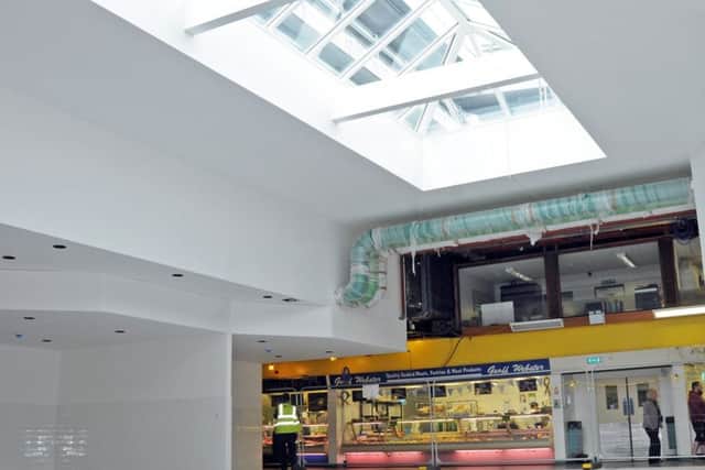 Phase one completed of Idlewells indoor market sees a new atrium which floods light into the central world foods area of the market hall.