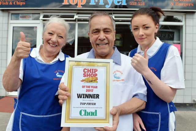Top Fryer in Sutton has been crowned winner of the Chad's chippy of the year contest. Pictured are owners Ann and Teyfik Marasli and, right, assistant Abbie Wilson.