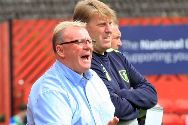 Steve Evans with Paul Raynor. Picture: Chris Etchells