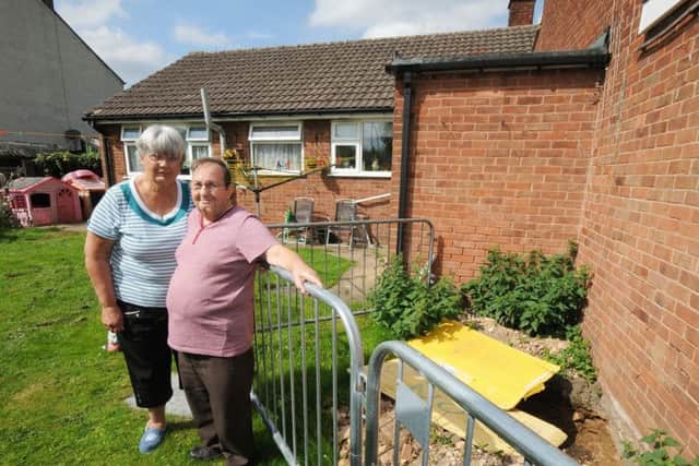 Ann and David Edmunds who have an unresolved subsidence problem in the garden of their Woodland View home in Langwith.