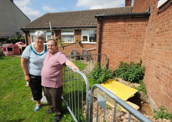 Ann and David Edmunds who have an unresolved subsidence problem in the garden of their Woodland View home in Langwith.