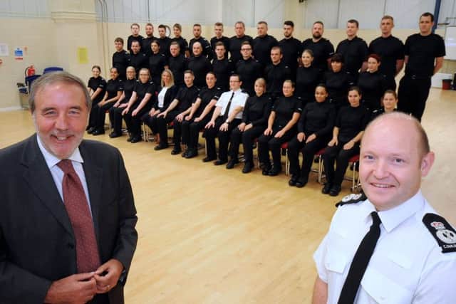 New Nottingham Police recruits line up with the Chief Constable, Craig Guildford, right,and Nottinghamshire's Police and Crime Commissioner Paddy Tipping, left, and constables, Alastair Roper and Lisa Davies.