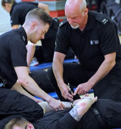 New Nottingham Police get training in restraint and arrest techniques.