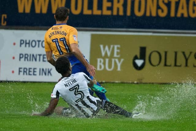Mansfield Town vs Rochdale - Heavy rain made for a saturated surface - Pic By James Williamson