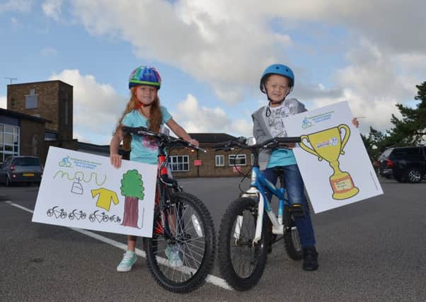 Winners of the Tour of Britain poster competition Saffron Keegan, six and Connor Chidlow, six