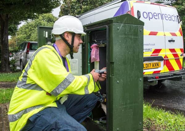 Openreach engineer Dom Bowers looking at a new G.fast cabinet as part of the work to roll out new ultrafast broadband.