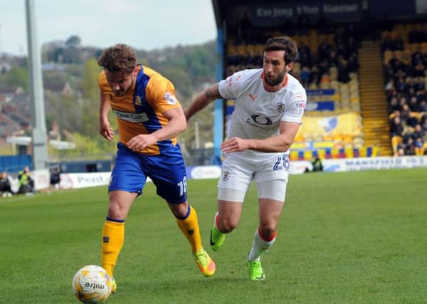 Mansfield Town v Luton.   
Alex MacDonald gives ex Stag Ollie Palmer the slip.