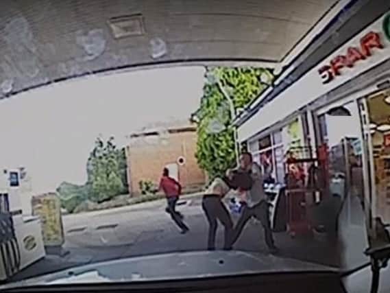 Karl Holden takes on the armed robbers at Castelle Service Station on Sherwood Street