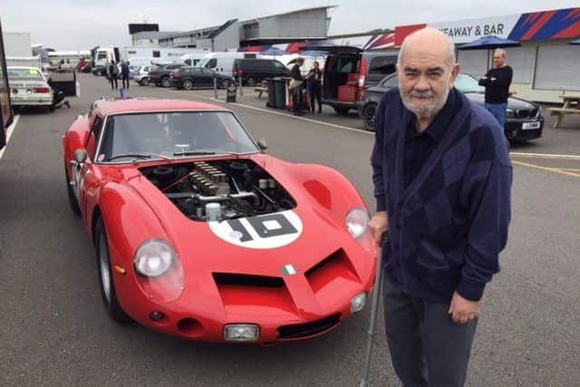 Taff Jones next to a Ferrari 250 GTO during his tour of Silverstone.