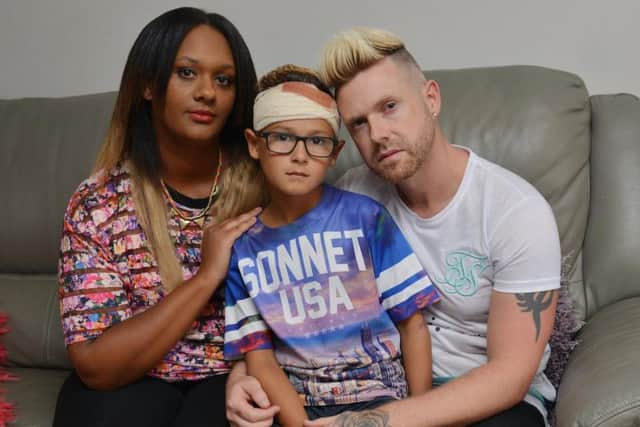 Romeo Smith, 9, with his mum Natasha and dad Craig