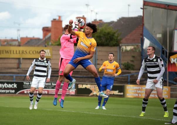 Lee Angol challenges Bradley Collins during Mansfield Town v Forest Green, United Kingdom, 12 August 2017. Photo by Glenn Ashley.