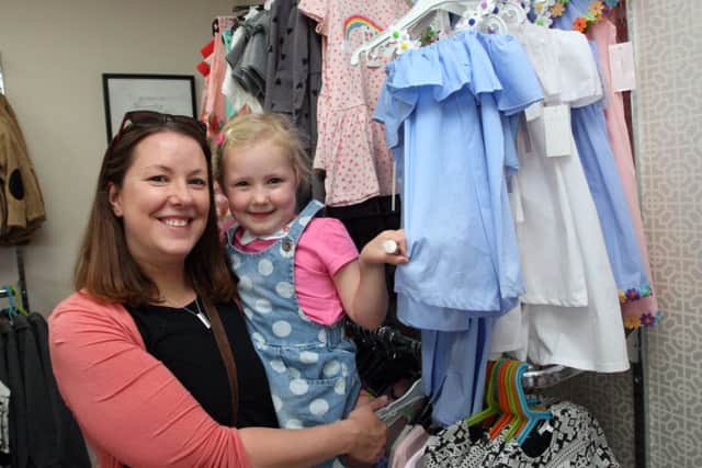 Looking for a pretty new dress at the Katwalk Kouture sale is Eleanor Wilkinson and daughter Edith.
