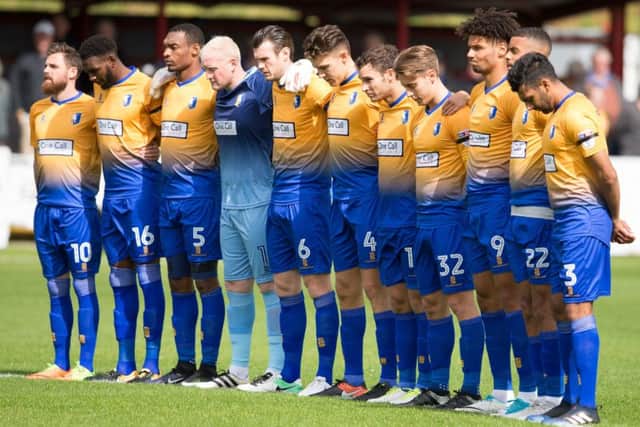 Accrington Stanley vs Mansfield - Mansfield players observe a minutes silence - Pic By James Williamson