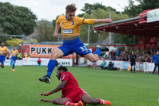 Accrington Stanley vs Mansfield - Danny Rose of Mansfield Town jumps clear of a tackle - Pic By James Williamson