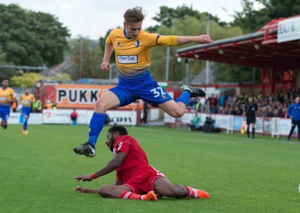 Accrington Stanley vs Mansfield - Danny Rose of Mansfield Town jumps clear of a tackle - Pic By James Williamson