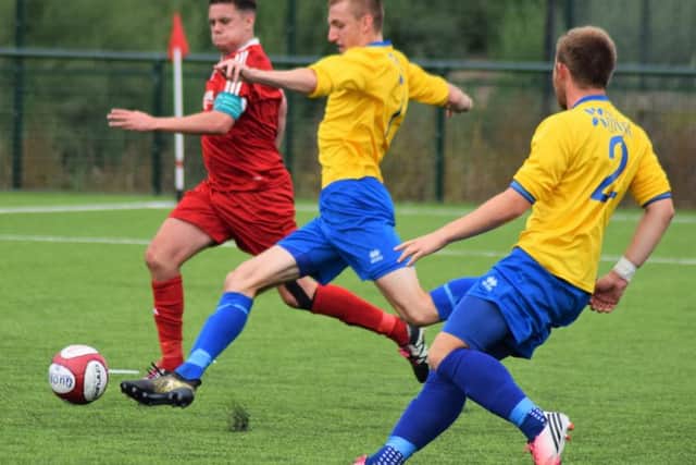 Hat-trick hero Ollie Fearon in action for AFC Mansfield in their FA Cup win at Quorn.