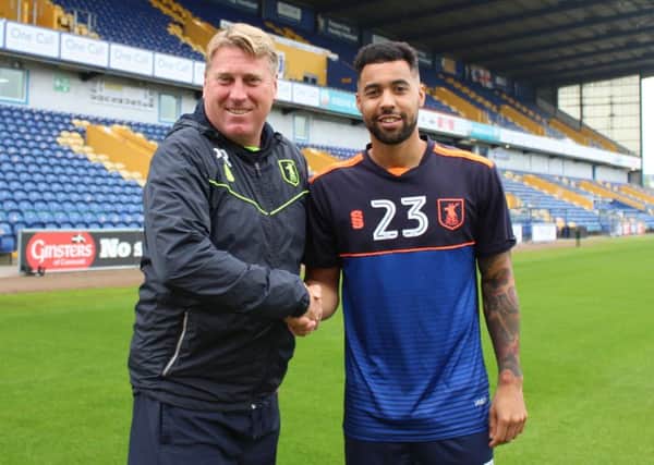 Assistant boss Paul Raynor welcomes Kane Hemmings to the One Call Stadium