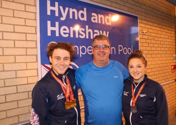 Ollie Hynd with his coach, Glenn Smith, and Charlotte Henshaw.