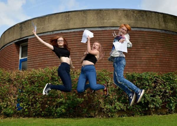 GCSE results day at All Saints Catholic Voluntary Academy, pictured are from left Tayler Harrison, Chelsea Gilliatt and Joshua Chant