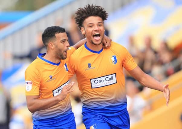 Lee Angol of Mansfield Town celebrates scoring his goal with Jacob Mellis of Mansfield Town  during the Sky Bet League 2 match between Mansfield Town and Luton Town at the One Call Stadium, Mansfield, England on 26 August 2017. Photo by Leila Coker.