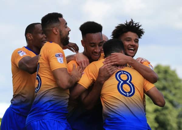 Rhys Bennett of Mansfield Town celebrates his goal with Mansfield Team mates during the Sky Bet League 2 match between Mansfield Town and Luton Town at the One Call Stadium, Mansfield, England on 26 August 2017. Photo by Leila Coker.