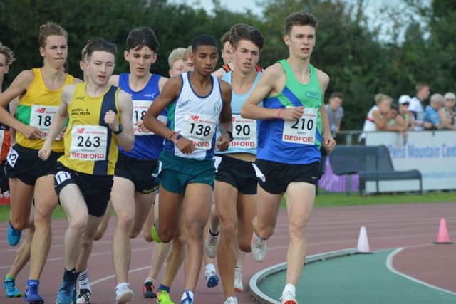 Mansfield Harriers' Luke Duffy leads the way in the heats of the U17s' 1500m.