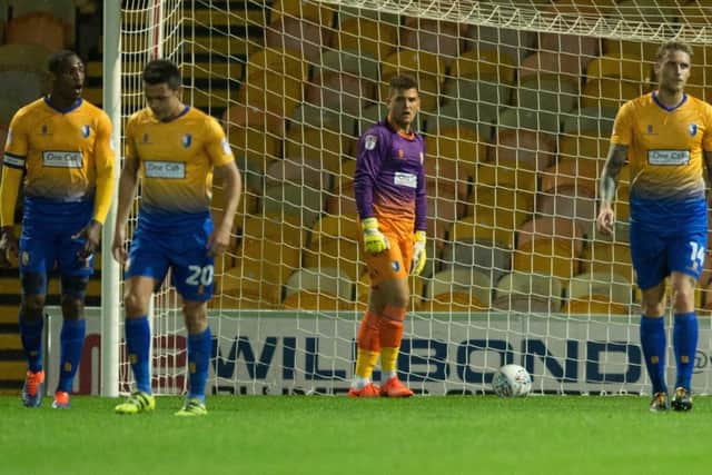 Mansfield players regroup after Elliott Whitehouse levels the scores. Pic By James Williamson