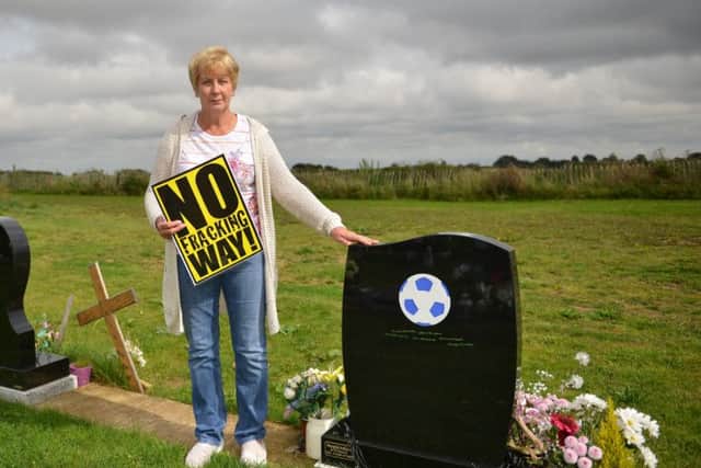 Ingrid Chapman is concerned about the effects on Oxcroft cemetery if proposed fracking goes ahead in Bolsover, Ingrid is pictured with her husbands headstone
