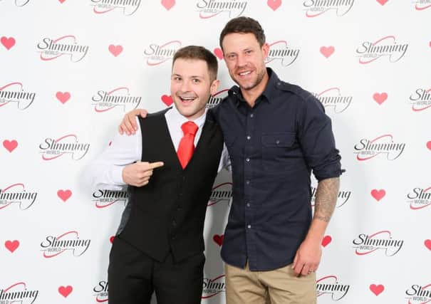 AFTER -- Jordan Martinez (left) is congratulated by former England footballer Wayne Bridge after his weight loss with Slimming World.