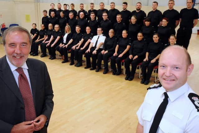 New Nottingham Police recruits line up with the Chief Constable, Craig Guildford, right,and Nottinghamshire's Police and Crime Commissioner Paddy Tipping, left, and constables, Alastair Roper and Lisa Davies.