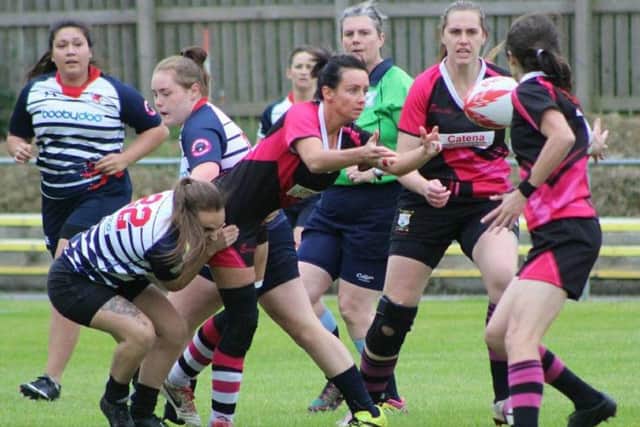 Try-scorer Vicki Fegan offloading the ball during Ashfield Ladies' defeat against Barnsley Ladies.