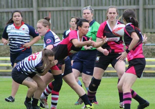 Try-scorer Vicki Fegan offloading the ball during Ashfield Ladies' defeat against Barnsley Ladies.