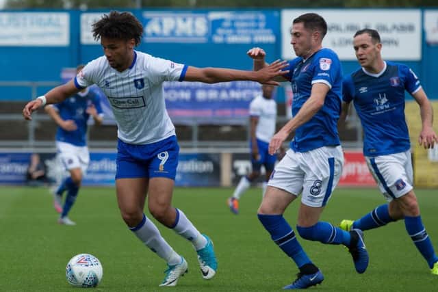 Carlisle United v Mansfield Town - Lee Angol of Mansfield Town holds off Mike Jones of Carlisle United - Pic By James Williamson