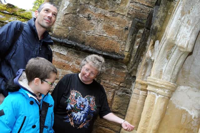 Richard Spray and his son Alexander are shown round the Old Annesley Church by Friend of the Church, Sue Hardy during their Heritage open day on Saturday.