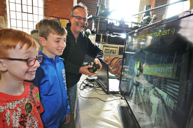 Owen and Daniel Birks are welcomed to the Pleasley Pit open day by a mining mouse which formed part of an audio visual display by Alan Andrews and his Art of Mining 3D exhibition.