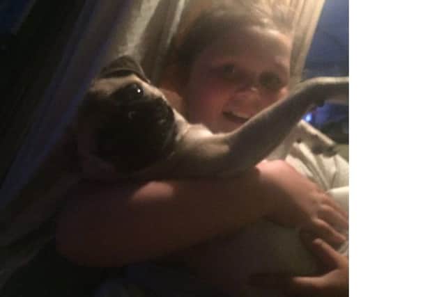 Lexi the pug, with Kloe Dickens, 11