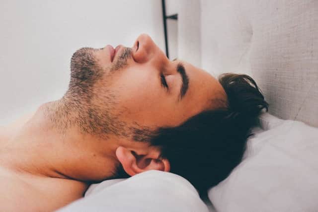Sleeping man. Photo by Pixabay.