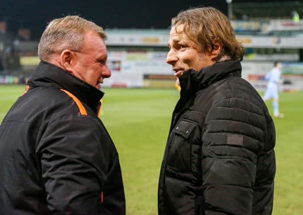 Mansfield Town's manager Steve Evans (left) speaks with Wycombe Wanderers manager Gareth Ainsworth- Photo by Chris Holloway