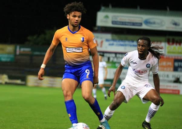 Lee Angol in action against Wycombe last week. Photo by Chris Etchells.