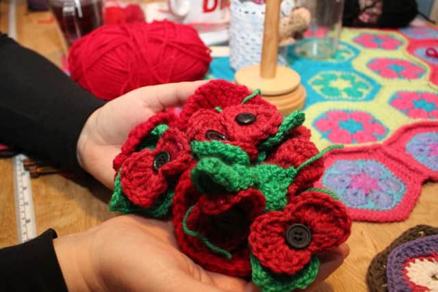 A cluster of the knitted and crocheted poppies that have been donated.