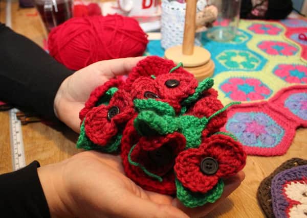 A cluster of the knitted and crocheted poppies that have been donated.